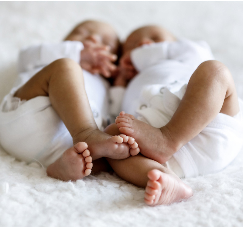 Newborn twin babie's feet