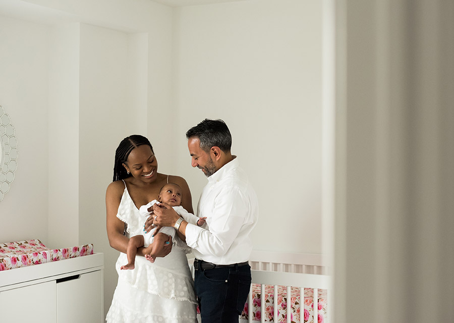 Parents with their newborn baby in the nursery