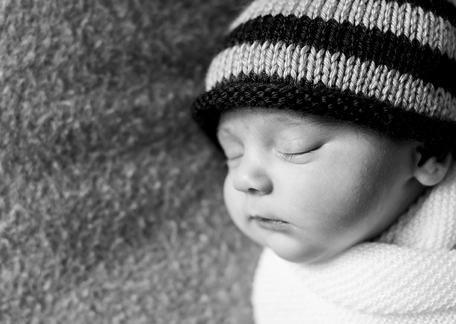 BW sleeping newborn baby with knit cap