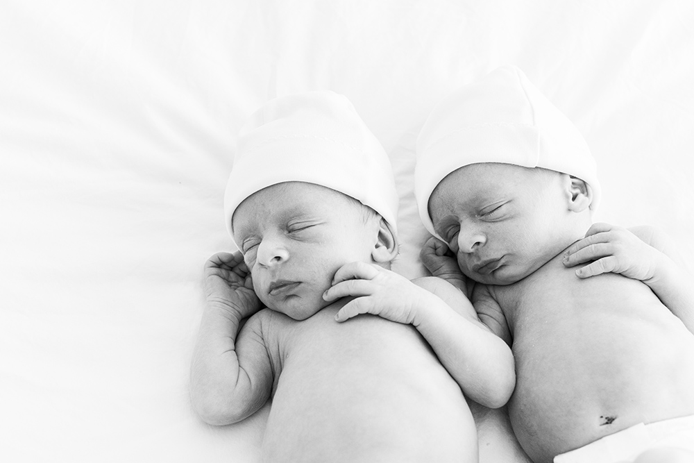 BW Sleeping newborn twin babies laying next to each other