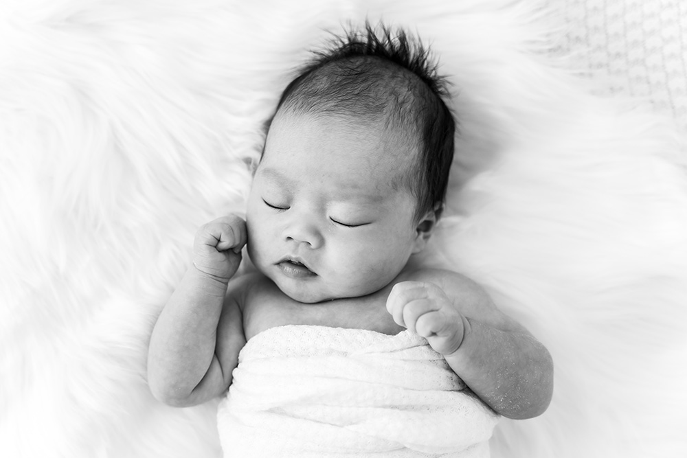Sleeping newborn baby black and white shot