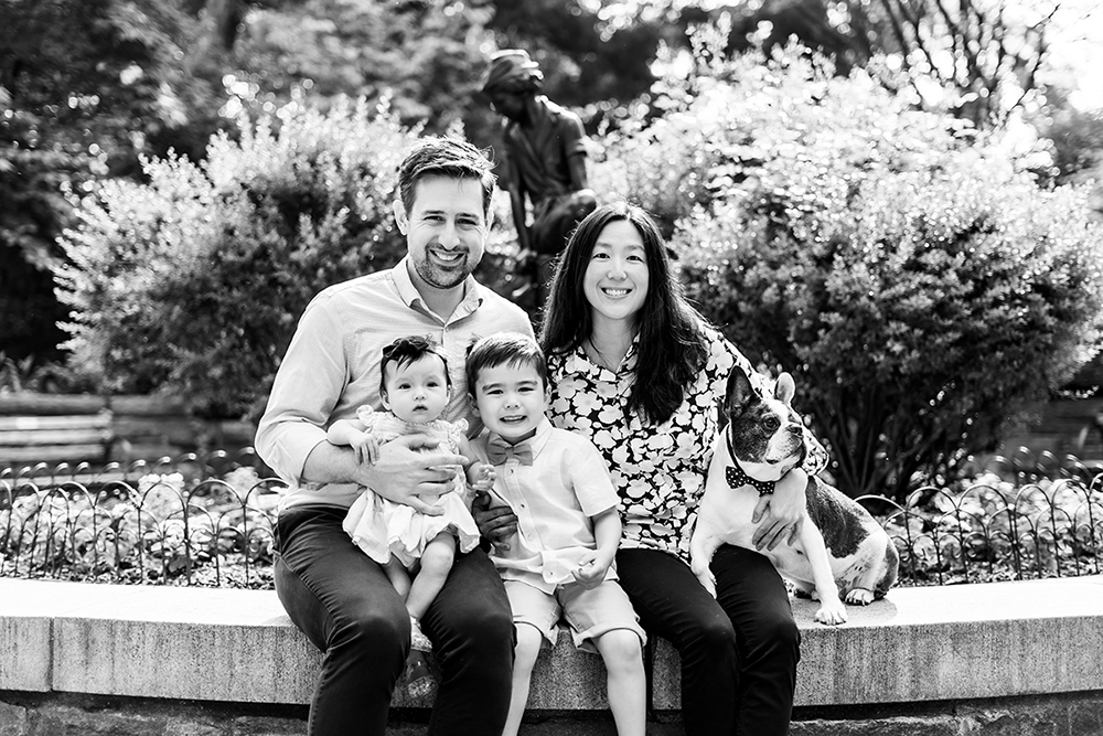 family of four with french bulldog