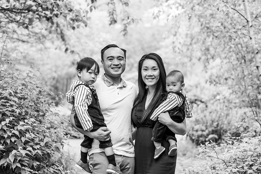 Black and White Photo of Family of Four in park
