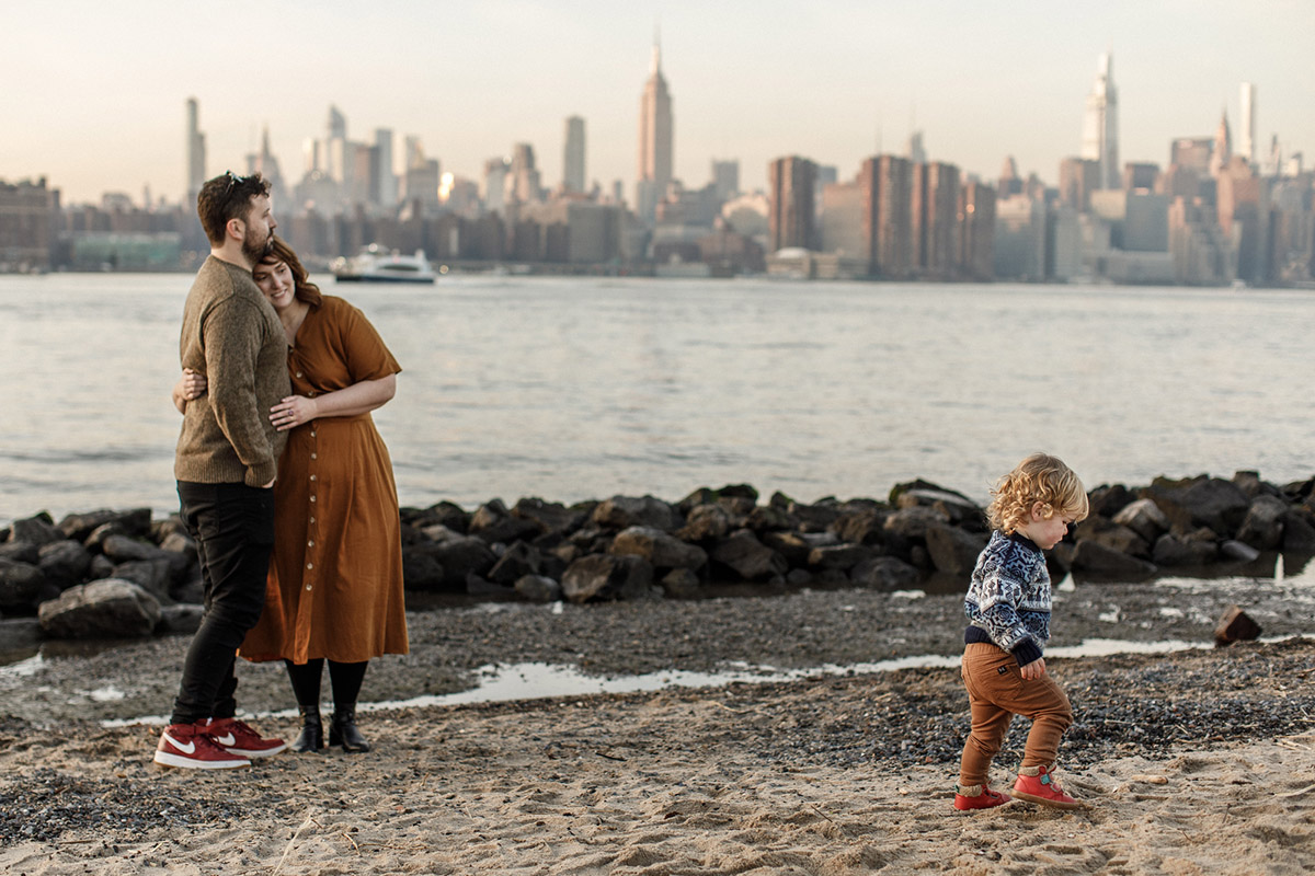 family photo in dumbo with new york skyline
