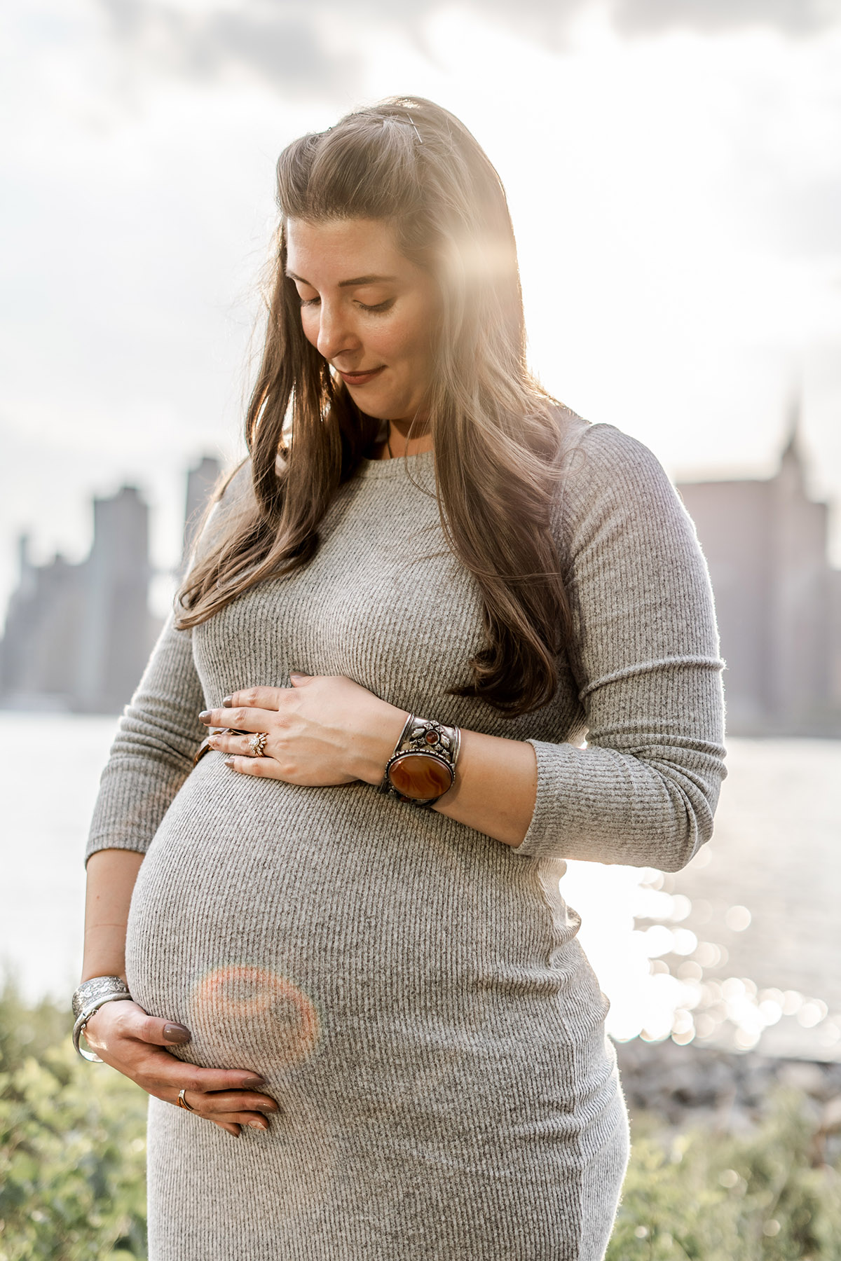 Maternity session in Hoboken mommy holding her belly