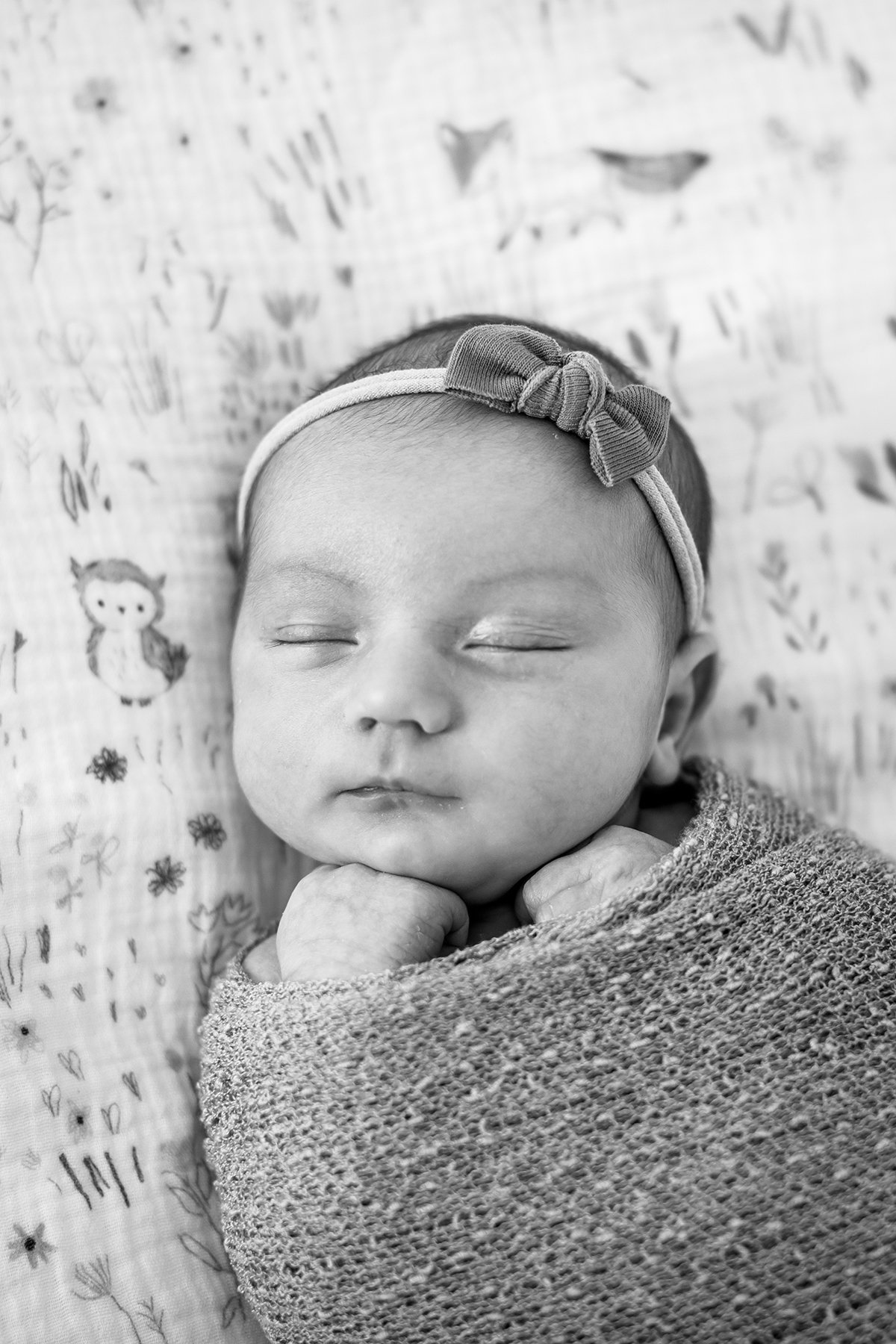 BW photo of a newborn baby girl