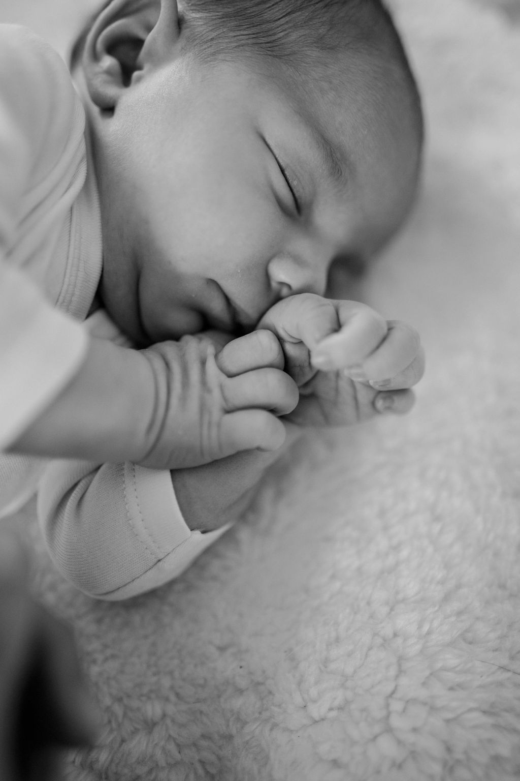 BW photo of sleeping newborn