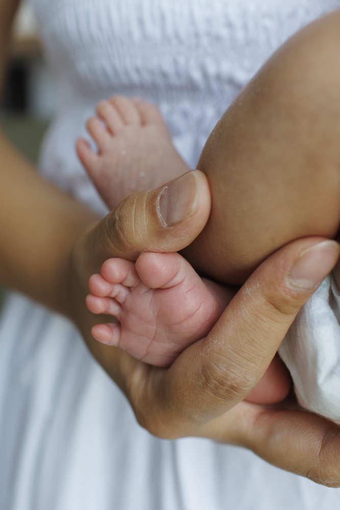 Baby Session, little tiny newborn foot between mother's fingers