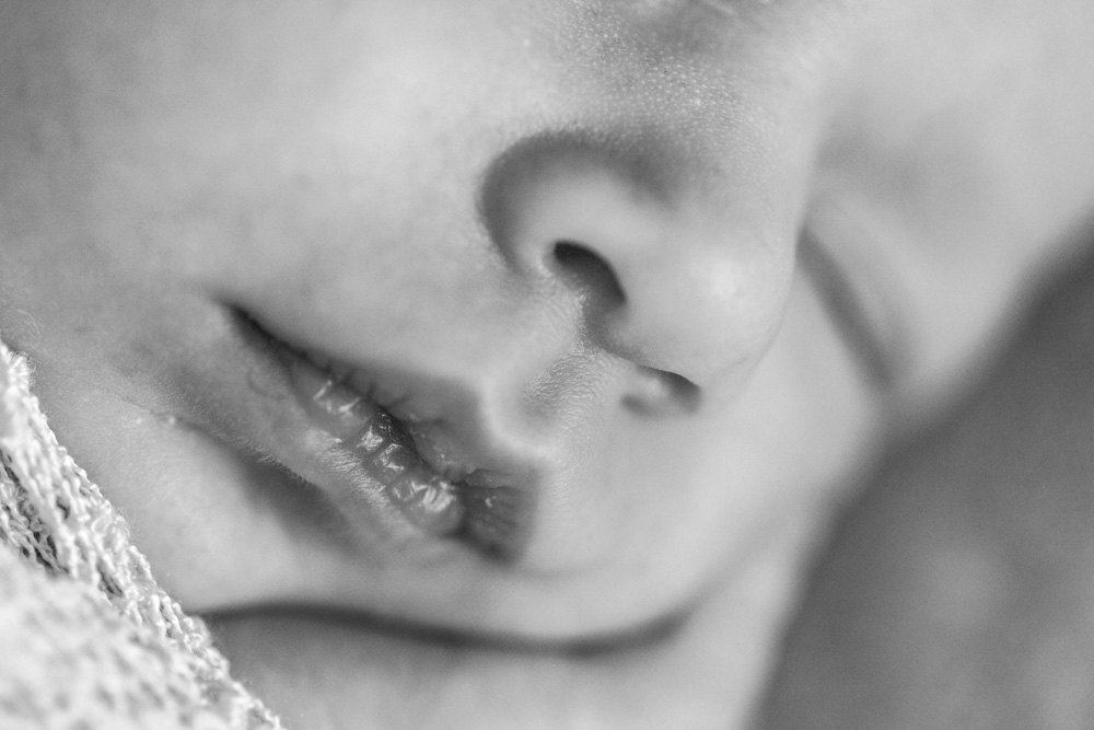 Baby Photography, black and white photo of a close up of a sleeping newborn baby's mouth and nose