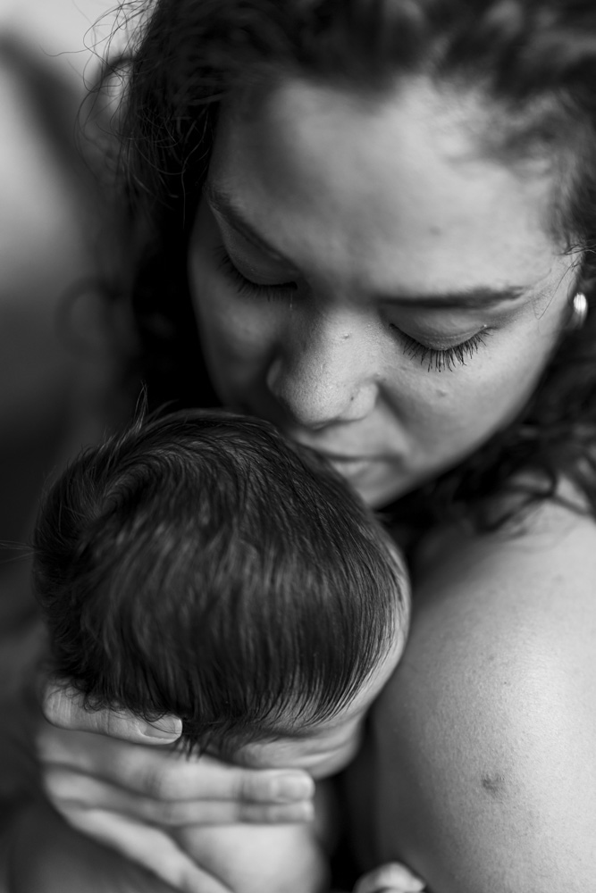 Baby Session, black and white photo, close up of mom holding her newborn close to her shoulder